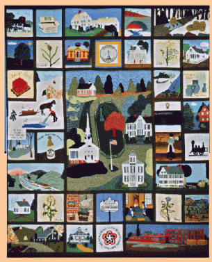 Photo of a 1976 quilt depicting many scenes from Chelmsford present and past.