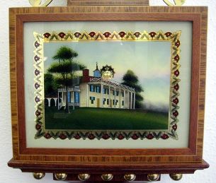 Detail photo of a clock panel showing Thomas Jefferson's home Monticello.